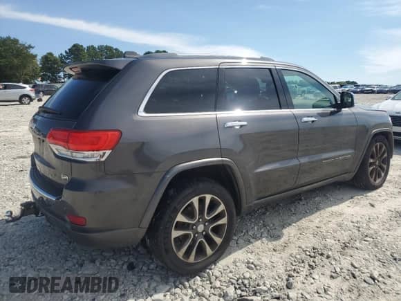 2017 Jeep Grand Cherokee Overland with VIN 1C4RJFCG9HC800659, listed as a Copart auction lot 67804285 with 105,483 mi miles and Salvage title. Bid and sale history available at DreamBid. Image 3.