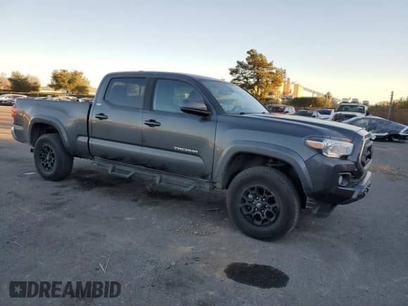 2020 Toyota Tacoma SR5 с VIN 3TMBZ5DN5LM023888, выставлен на аукционе Copart как лот 84208174 с пробегом 131 858 миль миль и Списание • Salvage title. История ставок и продаж доступна на DreamBid. Изображение 4.