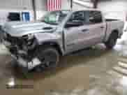 2025 Ram 1500 Tradesman with VIN 1C6RRFGG9SN681811, listed as a Copart auction lot 55799005 with 1,133 mi miles and Salvage title. Bid and sale history available at DreamBid. Image 1.