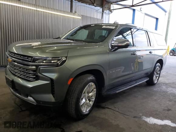 2023 Chevrolet Suburban Premier with VIN 1GNSCFKD8PR318691, listed as a Copart auction lot 87294985 with 94,427 mi miles and Clean title. Bid and sale history available at DreamBid. Image 1.