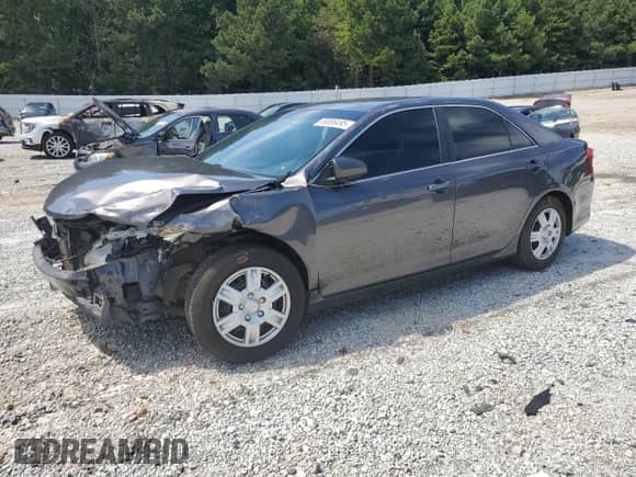 2014 Toyota Camry L with VIN 4T1BF1FK4EU765987, listed as a Copart auction lot 69086495 with 209,272 mi miles and Salvage title. Bid and sale history available at DreamBid. Image 1.