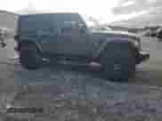 2022 Jeep Wrangler Unlimited Rubicon with VIN 1C4JJXFG6NW238566, listed as a Copart auction lot 84026995 with 23,187 mi miles and Salvage title. Bid and sale history available at DreamBid. Image 4.