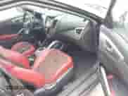 2012 Hyundai Veloster w/Red Int z VIN KMHTC6AD2CU076787, wystawiony jako IAAI lot #43056506 z przebiegiem 143 077 mil mil oraz . Historia ofert i sprzedaży dostępna na DreamBid. Obrazek 5.