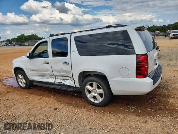 2008 Chevrolet Suburban LTZ with VIN 3GNFC16058G150599, listed as a Copart auction lot 84634985 with 240,831 mi miles and Salvage title. Bid and sale history available at DreamBid. Image 2.