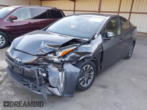 2022 Toyota Prius Nightshade with VIN JTDKAMFU4N3155017, listed as a IAAI auction lot 43013402 with 146,084 mi miles and . Bid and sale history available at DreamBid. Image 6.