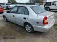 2002 Hyundai Accent GL z VIN KMHCG45C12U398748, wystawiony jako Copart lot #82077055 z przebiegiem 175 456 mil mil oraz Czysty tytuł • Clean title. Historia ofert i sprzedaży dostępna na DreamBid. Obrazek 2.