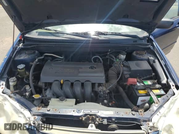 2004 Toyota Corolla CE z VIN 1NXBR32E04Z268677, wystawiony jako Copart lot #69282035 z przebiegiem 94 770 mil mil oraz Szkoda całkowita • Salvage title. Historia ofert i sprzedaży dostępna na DreamBid. Obrazek 11.