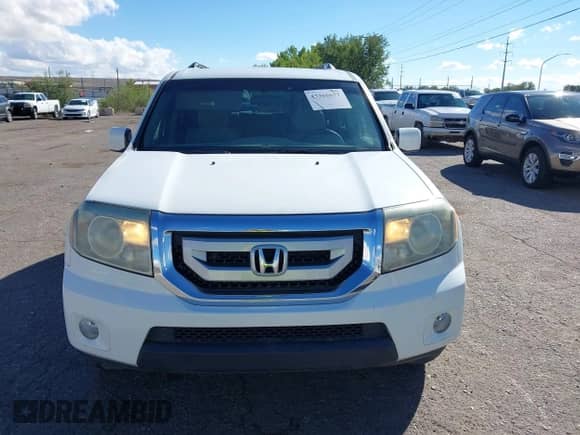 2011 Honda Pilot EX with VIN 5FNYF3H40BB016584, listed as a IAAI auction lot 43366677 with 234,469 mi miles and . Bid and sale history available at DreamBid. Image 12.