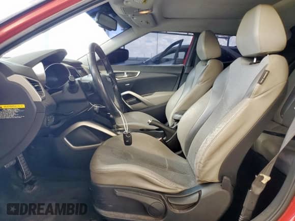 2012 Hyundai Veloster w/Gray Int z VIN KMHTC6AD2CU054207, wystawiony jako Copart lot #71825225 z przebiegiem 177 940 mil mil oraz Szkoda całkowita • Salvage title. Historia ofert i sprzedaży dostępna na DreamBid. Obrazek 7.