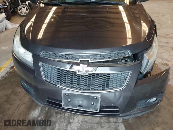 2014 Chevrolet Cruze LS z VIN 1G1PA5SG4E7185342, wystawiony jako IAAI lot #43365003 z przebiegiem 120 955 mil mil oraz . Historia ofert i sprzedaży dostępna na DreamBid. Obrazek 14.