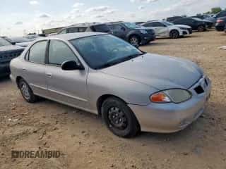 1999 Hyundai Elantra GL с VIN KMHJF25F1XU777099, выставлен на аукционе Copart как лот 58870035 с пробегом 69 470 миль миль и Чистый • Clean title. История ставок и продаж доступна на DreamBid. Изображение 4.
