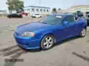 2005 Hyundai Tiburon GS с VIN KMHHM65D55U174406, выставлен на аукционе Copart как лот 64487555 с пробегом 206 900 миль миль и Списание • Salvage title. История ставок и продаж доступна на DreamBid. Изображение 1.