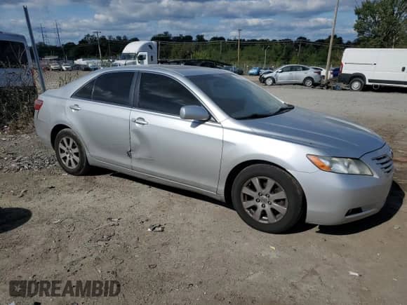 2007 Toyota Camry LE с VIN 4T1BK46K47U524897, выставлен на аукционе Copart как лот 84573195 с пробегом 306 736 миль миль и Списание • Salvage title. История ставок и продаж доступна на DreamBid. Изображение 4.