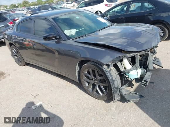 2021 Dodge Charger SXT with VIN 2C3CDXBG0MH633723, listed as a IAAI auction lot 43094395 with 76,533 mi miles and . Bid and sale history available at DreamBid. Image 1.