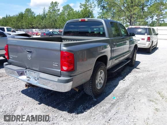 2005 Dodge Dakota SLT with VIN 1D7HE48N65S365506, listed as a IAAI auction lot 42588692 with 156,199 mi miles and . Bid and sale history available at DreamBid. Image 4.