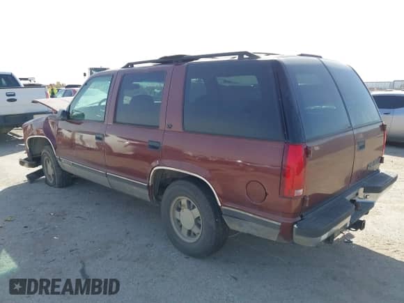 1999 Chevrolet Tahoe with VIN 1GNEC13R9XJ341261, listed as a IAAI auction lot 41741710 with 234,676 mi miles and . Bid and sale history available at DreamBid. Image 3.