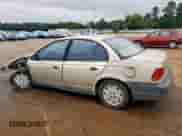 1997 Saturn SL with VIN 1G8ZF5284VZ404812, listed as a Copart auction lot 58836015 with 201,792 mi miles and Salvage title. Bid and sale history available at DreamBid. Image 2.