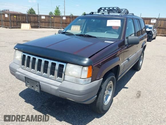 1996 Jeep Grand Cherokee Laredo z VIN 1J4GZ58Y2TC354076, wystawiony jako IAAI lot #42572842 z przebiegiem 172 282 mil mil oraz . Historia ofert i sprzedaży dostępna na DreamBid. Obrazek 2.