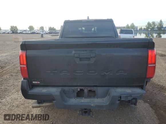 2024 Toyota Tacoma SR5 with VIN 3TYLB5JN2RT055045, listed as a Copart auction lot 69134065 with 25,584 mi miles and Salvage title. Bid and sale history available at DreamBid. Image 6.