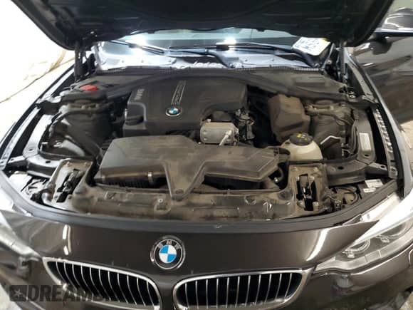 2015 BMW 4 Series 428i xDrive z VIN WBA4A7C59FD415525, wystawiony jako Copart lot #69001045 z przebiegiem 99 432 mil mil oraz Szkoda całkowita • Salvage title. Historia ofert i sprzedaży dostępna na DreamBid. Obrazek 11.