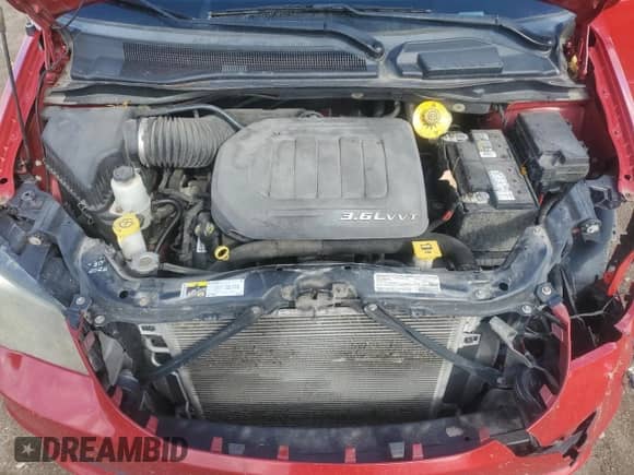 2013 Dodge Grand Caravan SXT with VIN 2C4RDGCG0DR817199, listed as a Copart auction lot 85567295 with 171,538 mi miles and Salvage title. Bid and sale history available at DreamBid. Image 12.