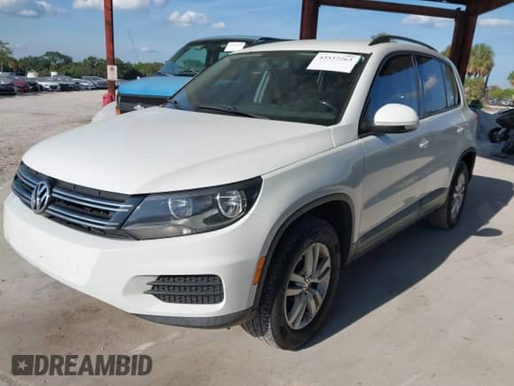2015 Volkswagen Tiguan S with VIN WVGAV7AXXFW571961, listed as a IAAI auction lot 43537263 with 147,521 mi miles and . Bid and sale history available at DreamBid. Image 2.