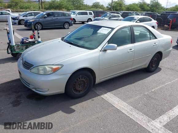 2002 Toyota Camry LE with VIN JTDBE32K720075369, listed as a IAAI auction lot 42644102 with 232,415 mi miles and . Bid and sale history available at DreamBid. Image 2.