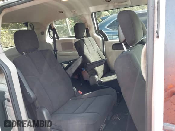2013 Dodge Grand Caravan SXT with VIN 2C4RDGCG3DR575542, listed as a IAAI auction lot 43406310 with 143,737 mi miles and . Bid and sale history available at DreamBid. Image 8.
