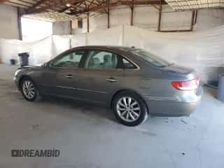 2007 Hyundai Azera SE z VIN KMHFC46F57A209495, wystawiony jako Copart lot #84614145 z przebiegiem 188 206 mil mil oraz Szkoda całkowita • Salvage title. Historia ofert i sprzedaży dostępna na DreamBid. Obrazek 2.