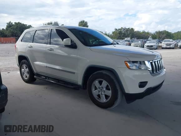 2012 Jeep Grand Cherokee Laredo z VIN 1C4RJEAG6CC227886, wystawiony jako IAAI lot #43547066 z przebiegiem 165 089 mil mil oraz . Historia ofert i sprzedaży dostępna na DreamBid. Obrazek 1.