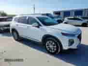 2020 Hyundai Santa Fe SE with VIN 5NMS2CAD6LH152004, listed as a Copart auction lot 69036565 with 77,411 mi miles and Salvage title. Bid and sale history available at DreamBid. Image 4.