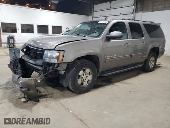 2011 Chevrolet Suburban LT with VIN 1GNSKJE38BR292711, listed as a Copart auction lot 82634175 with 213,707 mi miles and Salvage title. Bid and sale history available at DreamBid. Image 1.