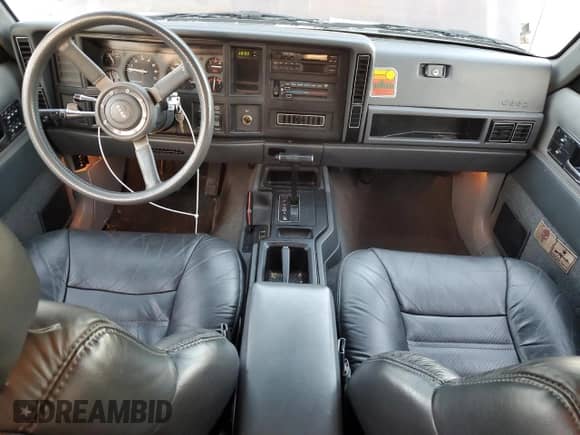 1989 Jeep Grand Cherokee with VIN 1J4FJ78L6KL643236, listed as a Copart auction lot 42989565 with 115,837 mi miles and Salvage title. Bid and sale history available at DreamBid. Image 8.