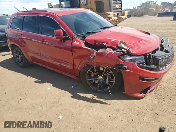 2014 Jeep Grand Cherokee SRT-8 z VIN 1C4RJFDJ4EC202579, wystawiony jako Copart lot #62811605 z przebiegiem 83 024 mil mil oraz Szkoda całkowita • Salvage title. Historia ofert i sprzedaży dostępna na DreamBid. Obrazek 4.