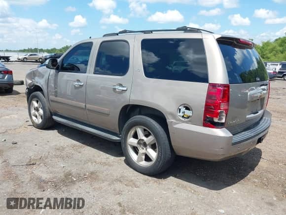 2007 Chevrolet Tahoe LT with VIN 1GNFC13057R312234, listed as a IAAI auction lot 42682255 with 326,289 mi miles and . Bid and sale history available at DreamBid. Image 3.