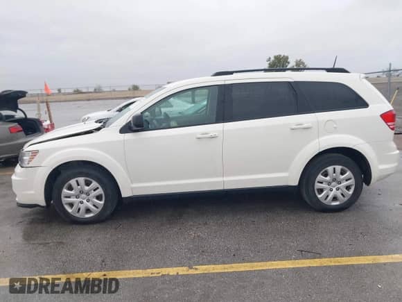 2019 Dodge Journey SE Value with VIN 3C4PDCAB8KT797348, listed as a IAAI auction lot 43378501 with 93,026 mi miles and . Bid and sale history available at DreamBid. Image 14.