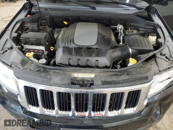 2012 Jeep Grand Cherokee Limited z VIN 1C4RJFBT9CC249950, wystawiony jako Copart lot #68299315 z przebiegiem 218 587 mil mil oraz Szkoda całkowita • Salvage title. Historia ofert i sprzedaży dostępna na DreamBid. Obrazek 12.