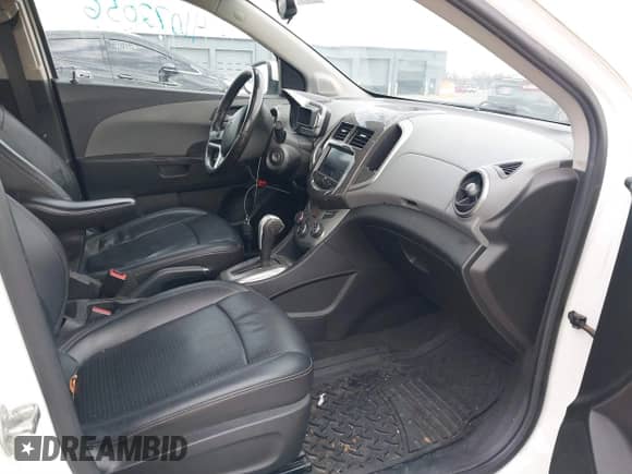 2014 Chevrolet Sonic LTZ with VIN 1G1JE5SH3E4133088, listed as a IAAI auction lot 41072056 with 143,855 mi miles and . Bid and sale history available at DreamBid. Image 5.