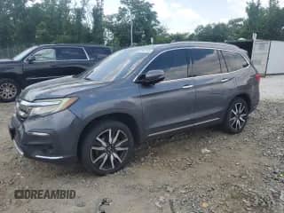 2021 Honda Pilot Touring 8-Passenger с VIN 5FNYF6H95MB048494, выставлен на аукционе Copart как лот 61347115 с пробегом 174 016 миль миль и Списание • Salvage title. История ставок и продаж доступна на DreamBid. Изображение 1.