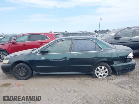 2001 Honda Accord EX with VIN 1HGCG56631A065309, listed as a IAAI auction lot 42584671 with 245,741 mi miles and . Bid and sale history available at DreamBid. Image 14.