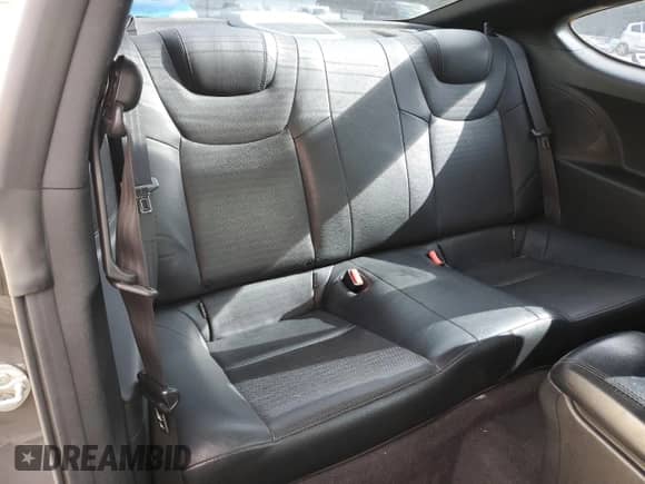 2013 Hyundai Genesis Coupe R-Spec z VIN KMHHU6KJ1DU096070, wystawiony jako Copart lot #60842815 z przebiegiem 99 667 mil mil oraz Szkoda całkowita • Salvage title. Historia ofert i sprzedaży dostępna na DreamBid. Obrazek 10.