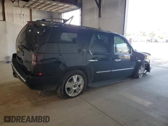 2009 Chevrolet Tahoe LTZ with VIN 1GNFK33049R293760, listed as a Copart auction lot 64834775 with 135,727 mi miles and Salvage title. Bid and sale history available at DreamBid. Image 3.
