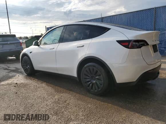2023 Tesla Model Y Long Range with VIN 7SAYGAEE4PF863973, listed as a Copart auction lot 67838404 with 25,165 mi miles and Salvage title. Bid and sale history available at DreamBid. Image 2.