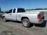 2005 Dodge Dakota SLT with VIN 1D7HE42K65S163019, listed as a Copart auction lot 67673975 with 118,096 mi miles and Salvage title. Bid and sale history available at DreamBid. Image 2.