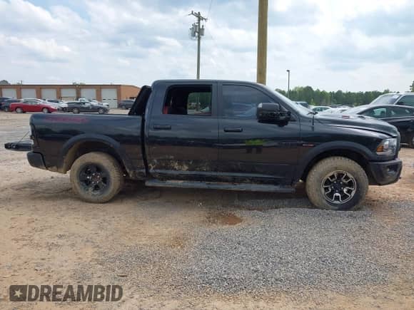 2018 Ram 1500 Rebel with VIN 1C6RR7YT4JS151036, listed as a IAAI auction lot 41988370 with 72,587 mi miles and . Bid and sale history available at DreamBid. Image 14.