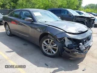 2022 Dodge Charger SXT with VIN 2C3CDXJG1NH186824, listed as a IAAI auction lot 42597441 with 59,281 mi miles and . Bid and sale history available at DreamBid. Image 1.