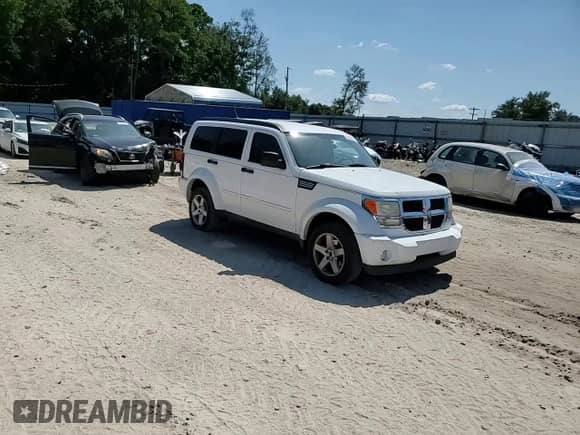 2011 Dodge Nitro SE z VIN 1D4PT2GK6BW595285, wystawiony jako Copart lot #80345735 z przebiegiem 168 147 mil mil oraz Szkoda całkowita • Salvage title. Historia ofert i sprzedaży dostępna na DreamBid. Obrazek 14.