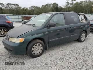 1999 Honda Odyssey LX with VIN 2HKRL1857XH502019, listed as a Copart auction lot 78162204 with 184,504 mi miles and Salvage title. Bid and sale history available at DreamBid. Image 1.