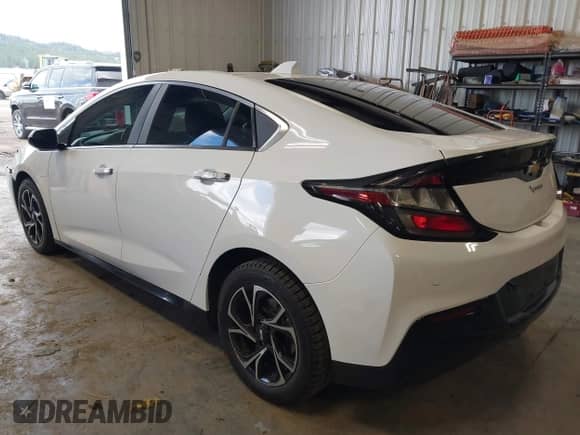 2016 Chevrolet Volt Premier z VIN 1G1RD6S55GU129046, wystawiony jako IAAI lot #41990980 z przebiegiem 96 901 mil mil oraz . Historia ofert i sprzedaży dostępna na DreamBid. Obrazek 3.