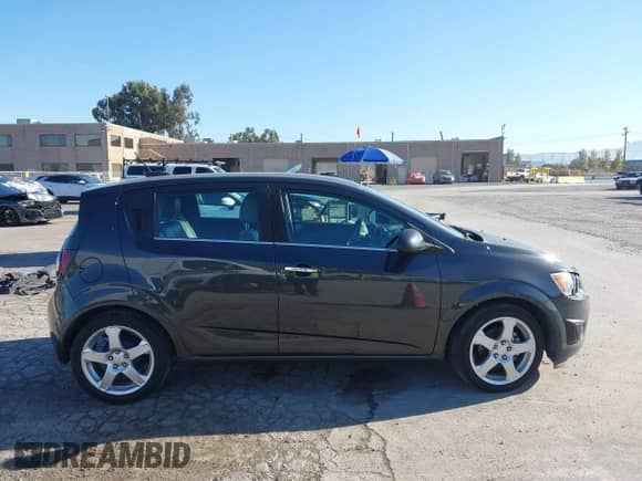 2015 Chevrolet Sonic LTZ with VIN 1G1JE6SB6F4125831, listed as a IAAI auction lot 43364524 with 152,774 mi miles and . Bid and sale history available at DreamBid. Image 13.